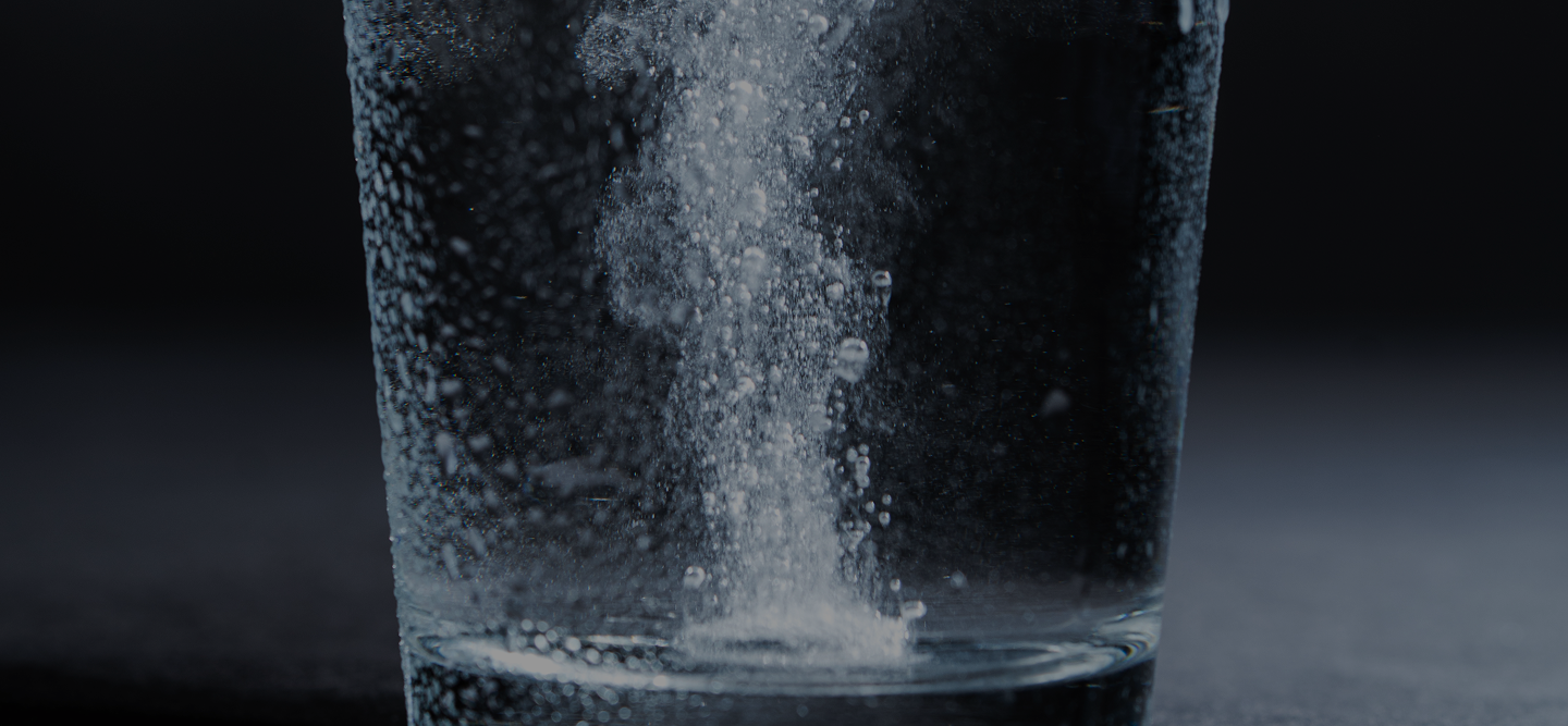bubbling hydrogen tablet in glass of water